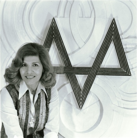 Monir with one of her relief pieces in the 1970s, photo courtesy of the artist